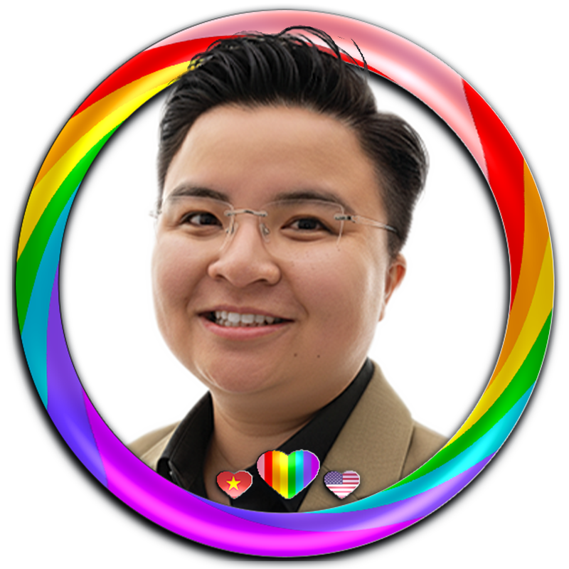 Ảnh chân dung studio chuyên nghiệp của Trang, sáng lập Trang Designs. Trang diện mặc vest beige khoác ngoài áo sơ mi đen lịch lãm phối cùng kính gọng khoan (frameless glasses) chụp trên nền xám tối giản với ánh sáng studio mềm mại